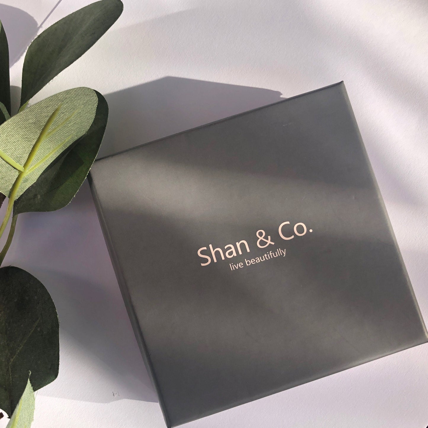 Shan&Co's Gold Vermeil Black CZ Hoop Earrings, featuring sparkling black crystal zirconia stones in a sleek pave design, perfect for adding a bold yet elegant touch to any look.