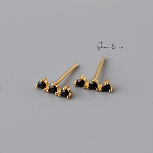 Shan&Co Gold Vermeil Bar Studs Earrings with a sleek geometric design and Geometric Line Minimalist Studs featuring vibrant turquoise accents, perfect for adding a modern and elegant touch to any outfit.