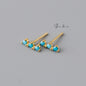 Shan&Co Gold Vermeil Bar Studs Earrings with a sleek geometric design and Geometric Line Minimalist Studs featuring vibrant turquoise accents, perfect for adding a modern and elegant touch to any outfit.