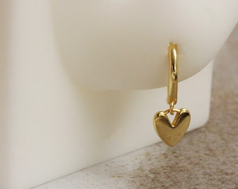 Gold Vermeil/Sterling Silver Heart Dangle Hoop Earrings featuring delicate heart-shaped dangles on classic hoops. These lightweight, stylish earrings offer a polished, luxurious finish, perfect for adding romantic charm to any outfit.