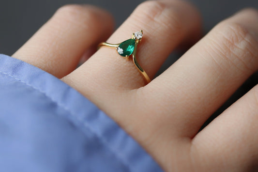 Gold Vermeil Vintage Emerald CZ Ring featuring a marquise-cut emerald-colored CZ crystal and sparkling CZ accents on an open band design. Elegant and adjustable, perfect for stacking or solo wear.